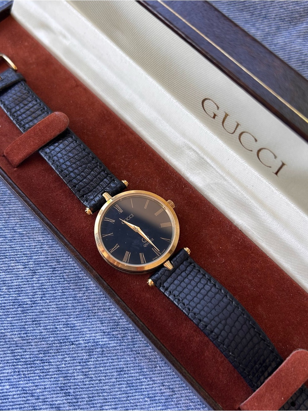 Gucci Black and Gold Round Watch